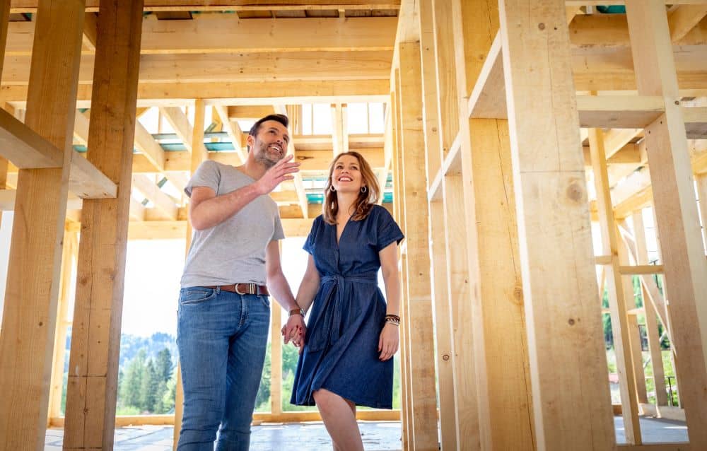 Couple checking their house under construction.
